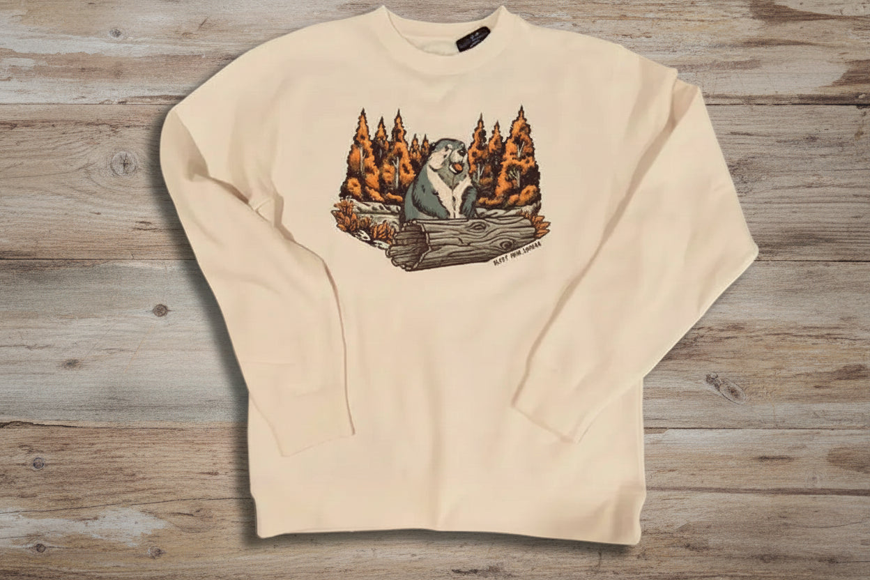 Cream sweatshirt with a graphic of a groundhog and woodland background